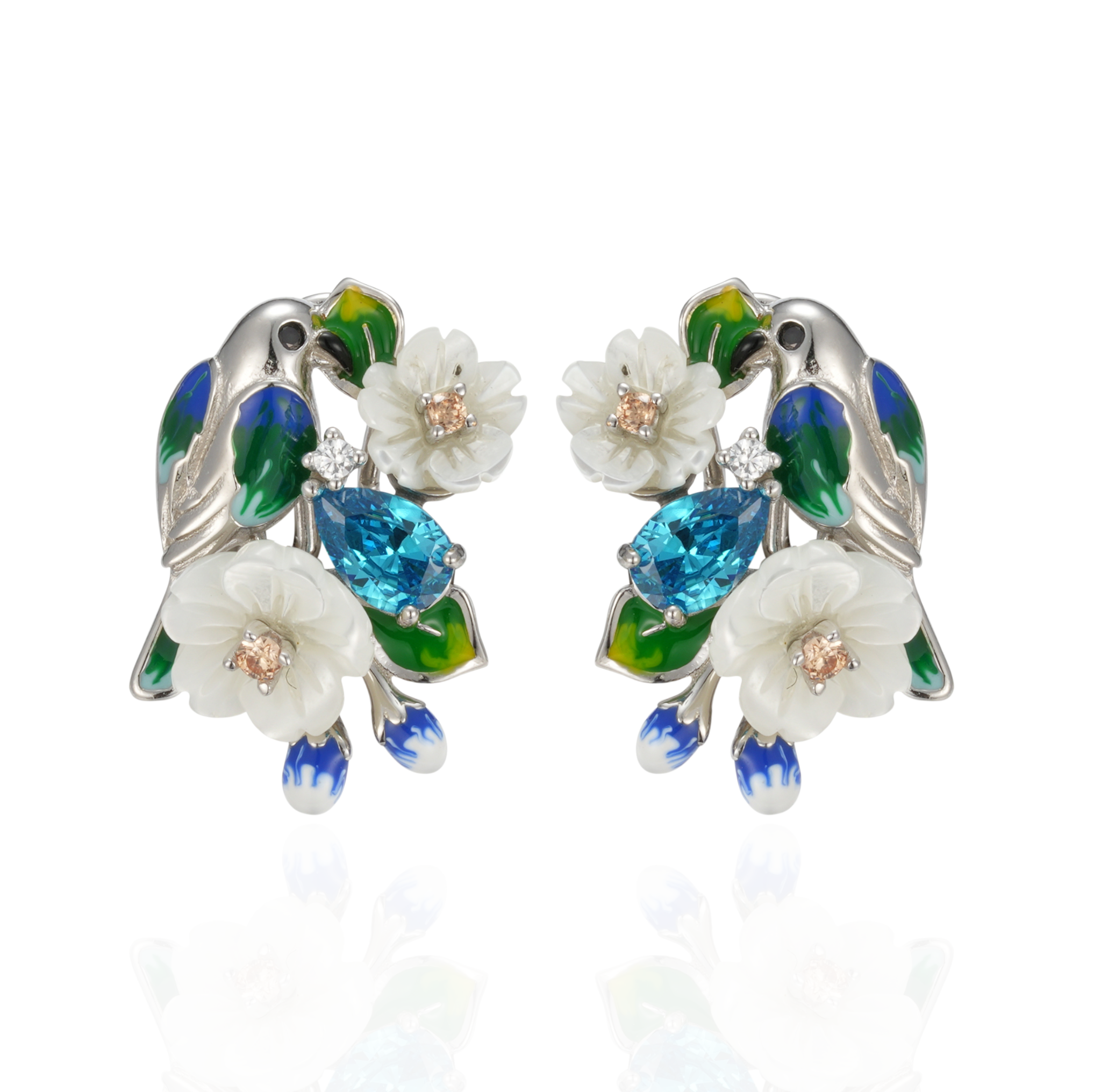 A pair of silver earrings with blue stones, enamel, shell flowers and a bird charm.