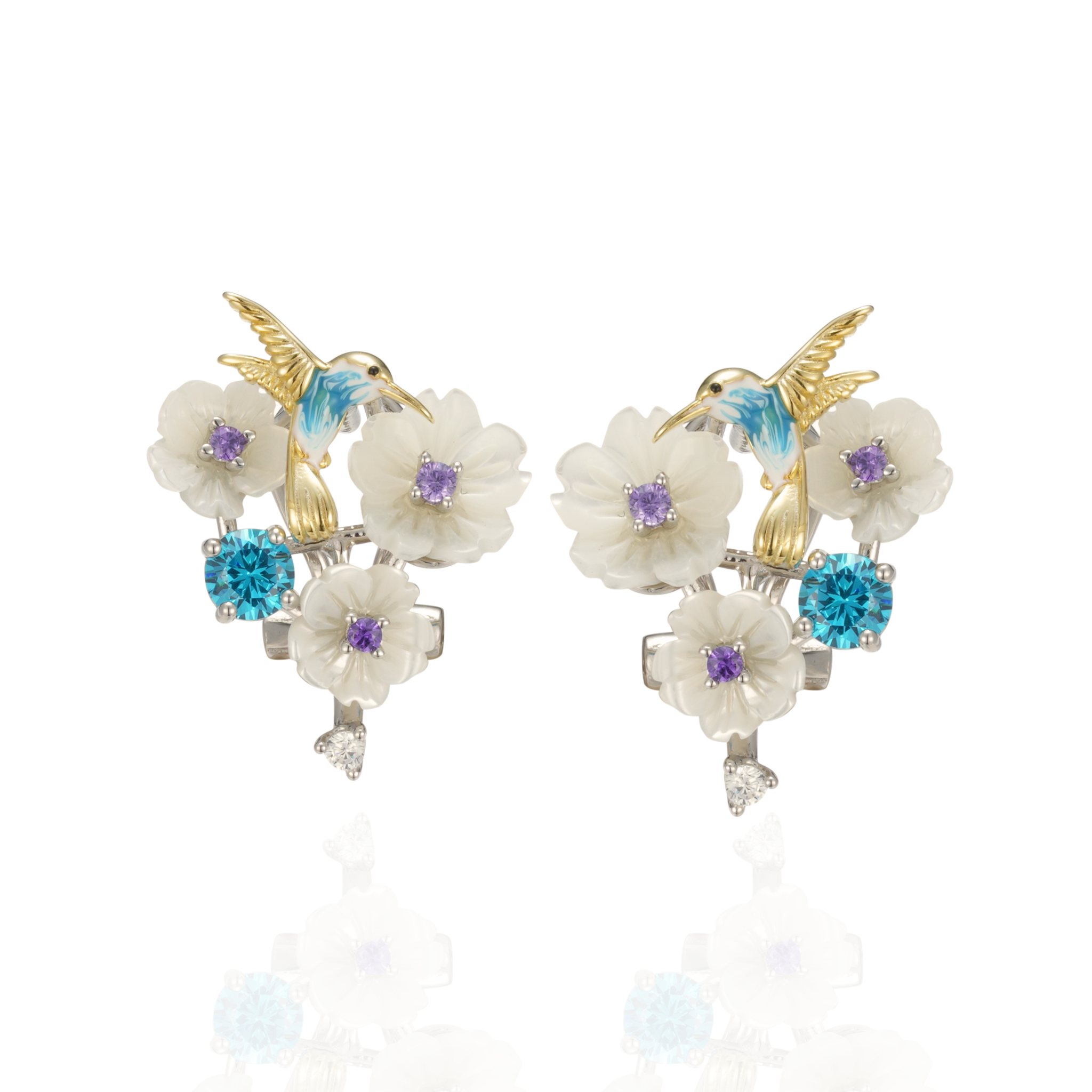 A pair of silver gold plated earrings with blue stones, enamel, shell flowers and a bird charm.