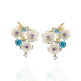 A pair of silver gold plated earrings with blue stones, enamel, shell flowers and a bird charm.