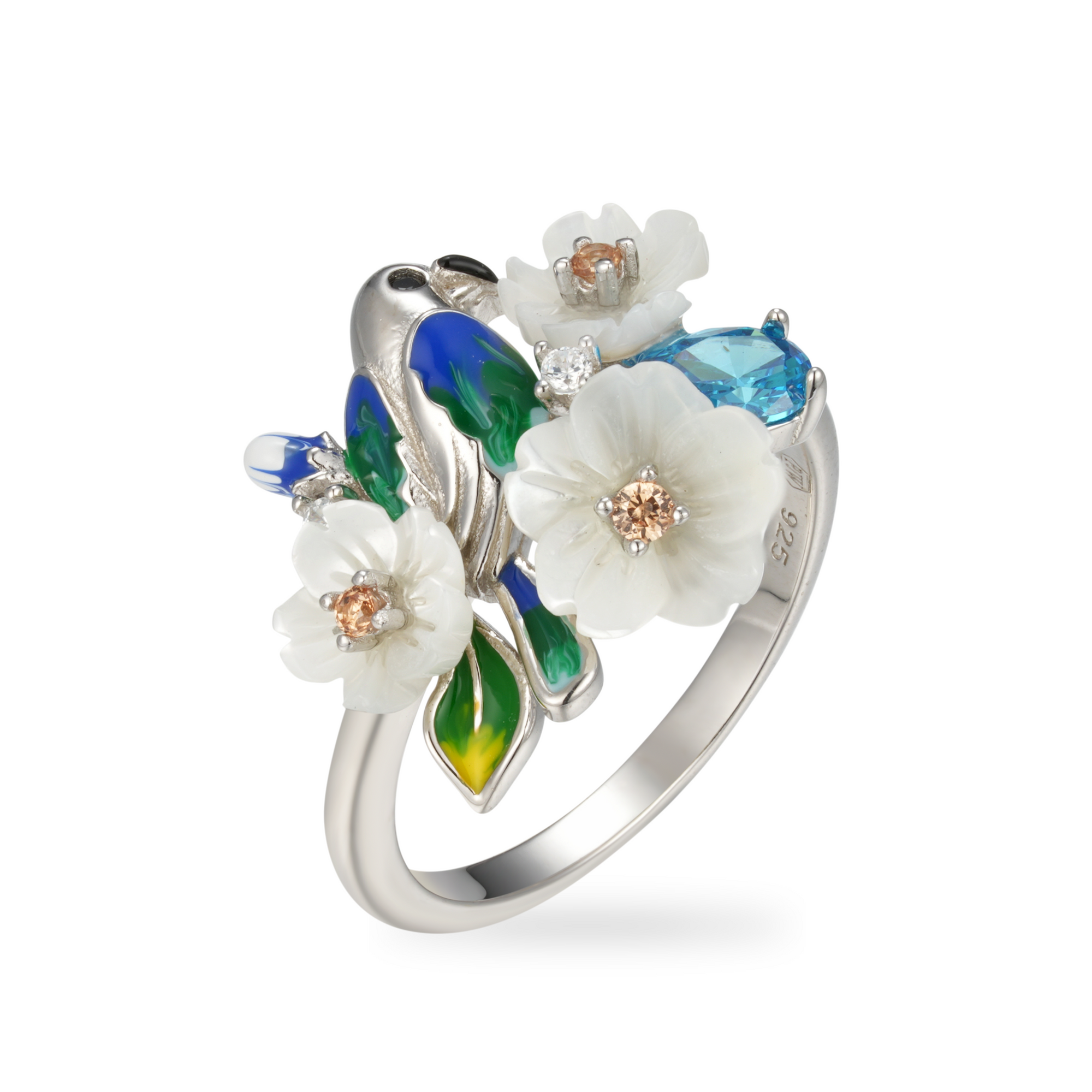 A silver ring with enamel, shell flowers, blue stones and a bird charm.