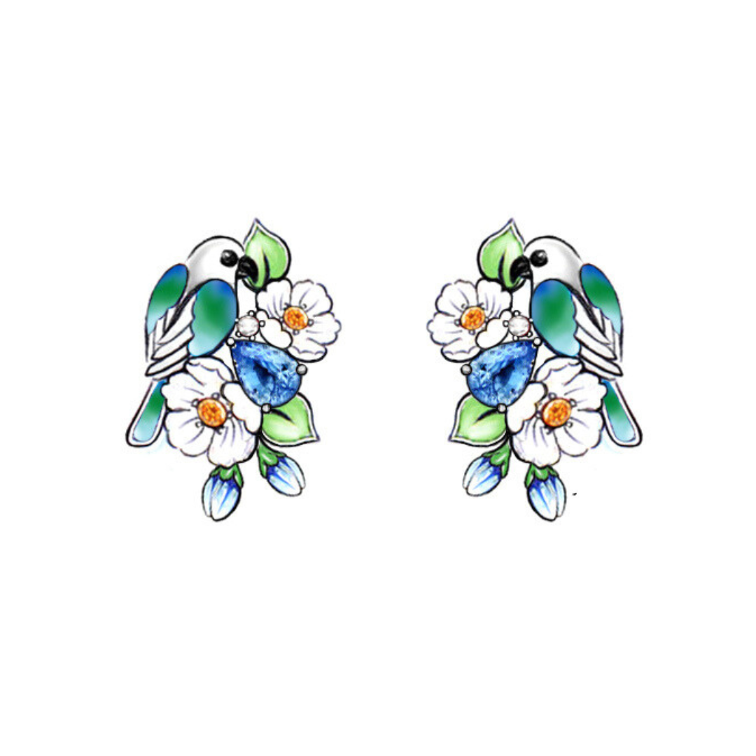 A pair of silver earrings with blue stones, enamel, shell flowers and a bird charm.