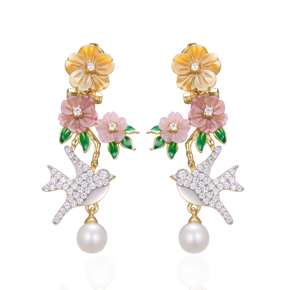 A pair of gold plated earrings with pearls, green stones, yellow, purple, pink shell flowers and a bird charm.