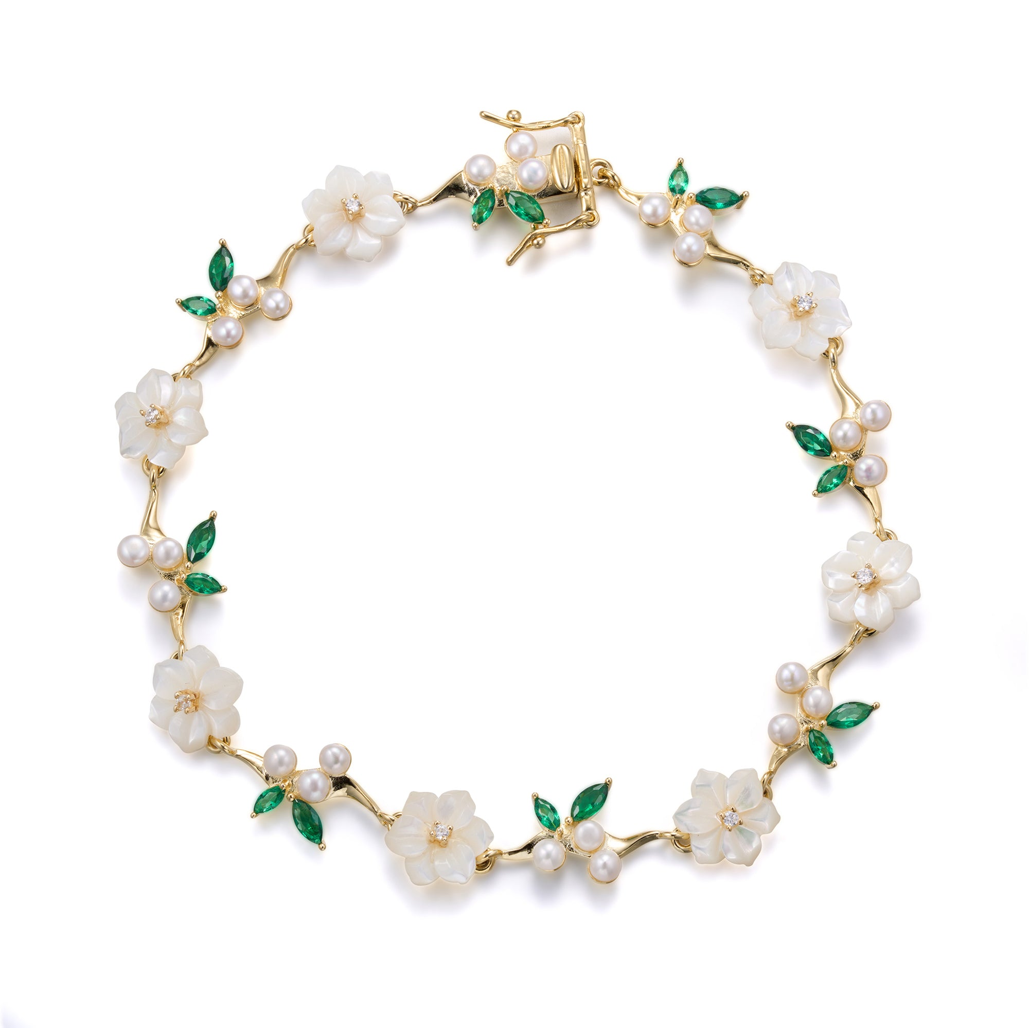 A silver gold plated bracelet with green stones, pearls and shell flowers.